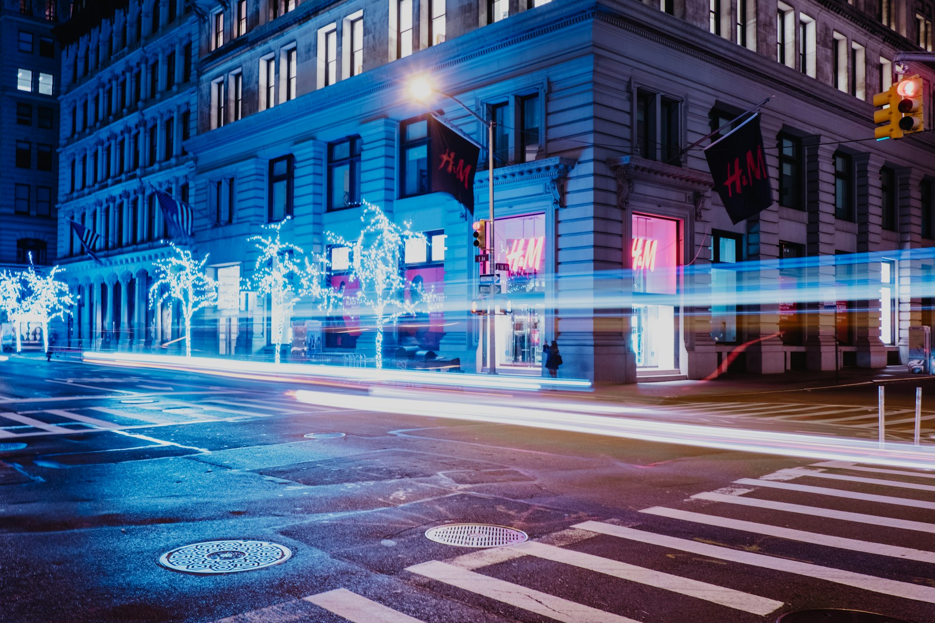 Manhattan street at night with light trails