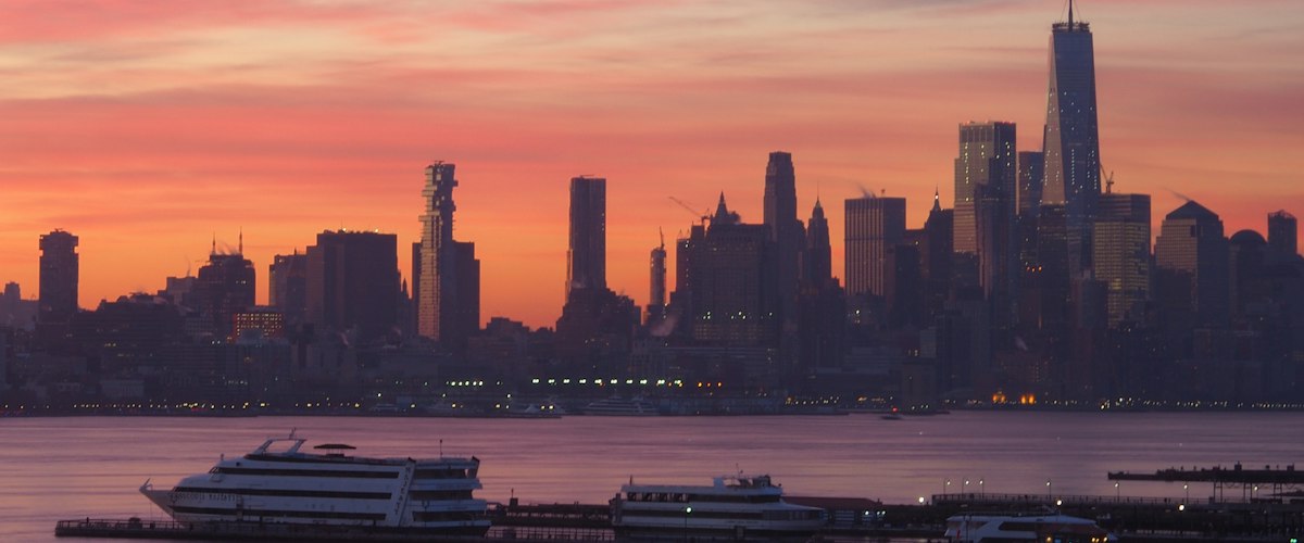 Manhattan skyline from the water at sunset